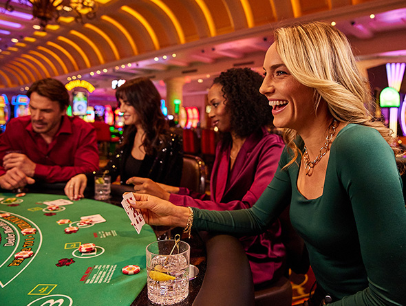 group of people exploring their offers by playing blackjack in las vegas