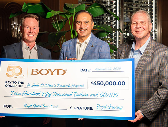 boyd leadership presents a check to a charity from guest winning donations