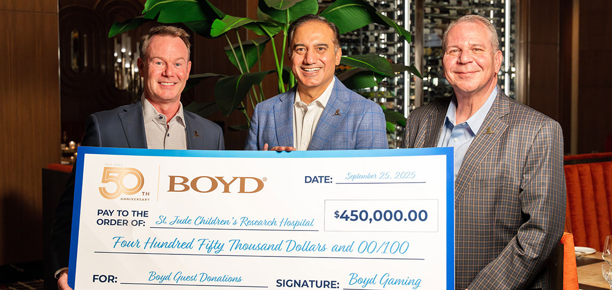 boyd leadership presents a check to a charity from guest winning donations