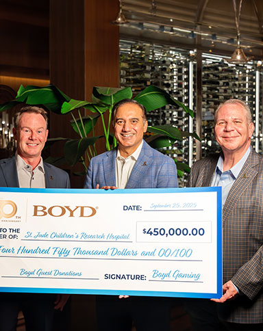 boyd leadership presents a check to a charity from guest winning donations