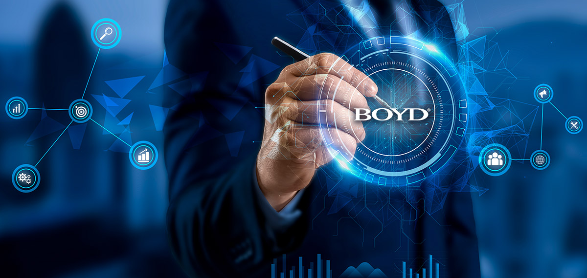 man holding pen with electronic effects and the Boyd logo
