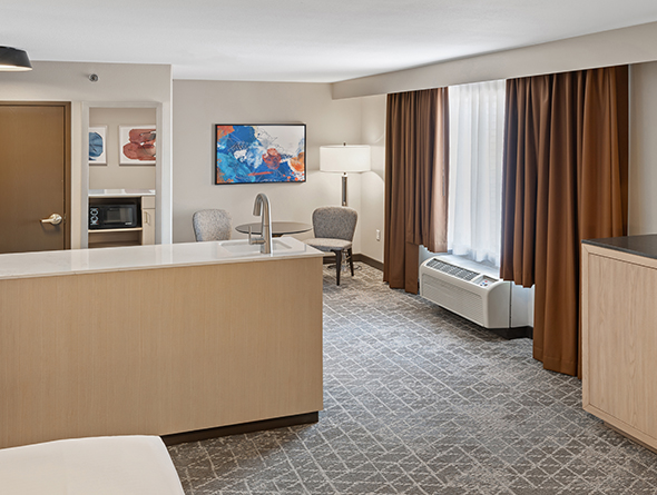 king studio room with sitting area at diamond jo casino & hotel