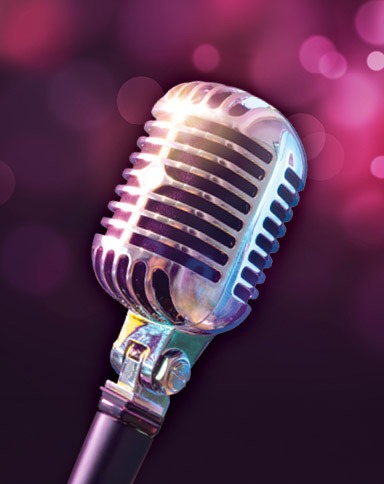 Old school microphone on a rose colored background