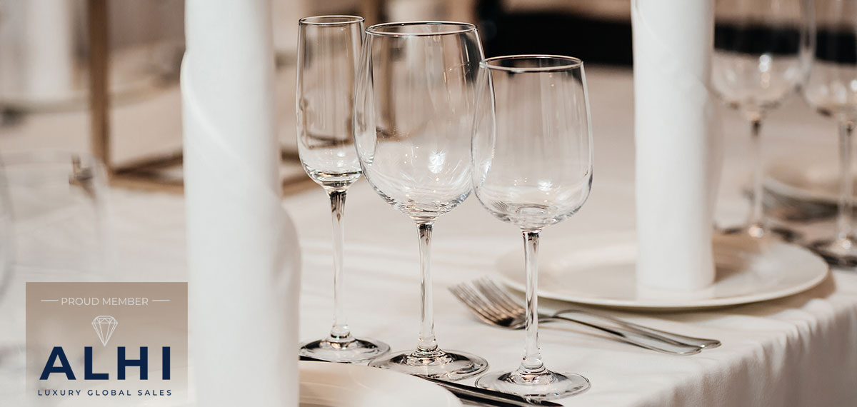wineglasses on a table image with ALHI logo