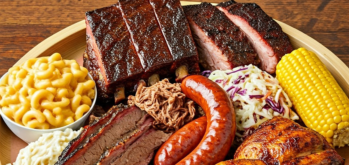 variety of barbecued meats and baked beans
