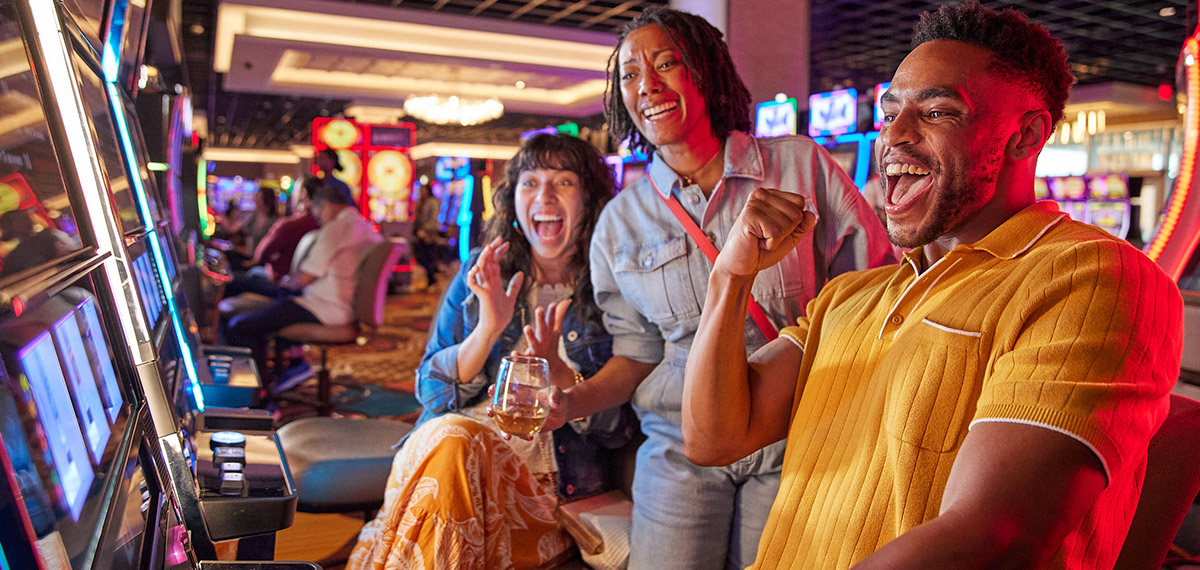 group playing slot machines
