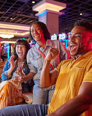 group playing slot machines