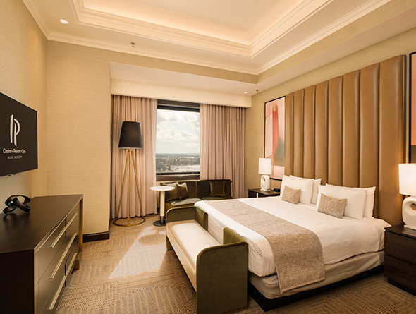 IP hotel room with desk and tv