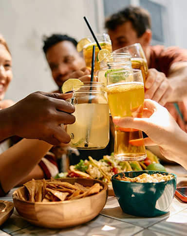friends raising their glasses in a toast