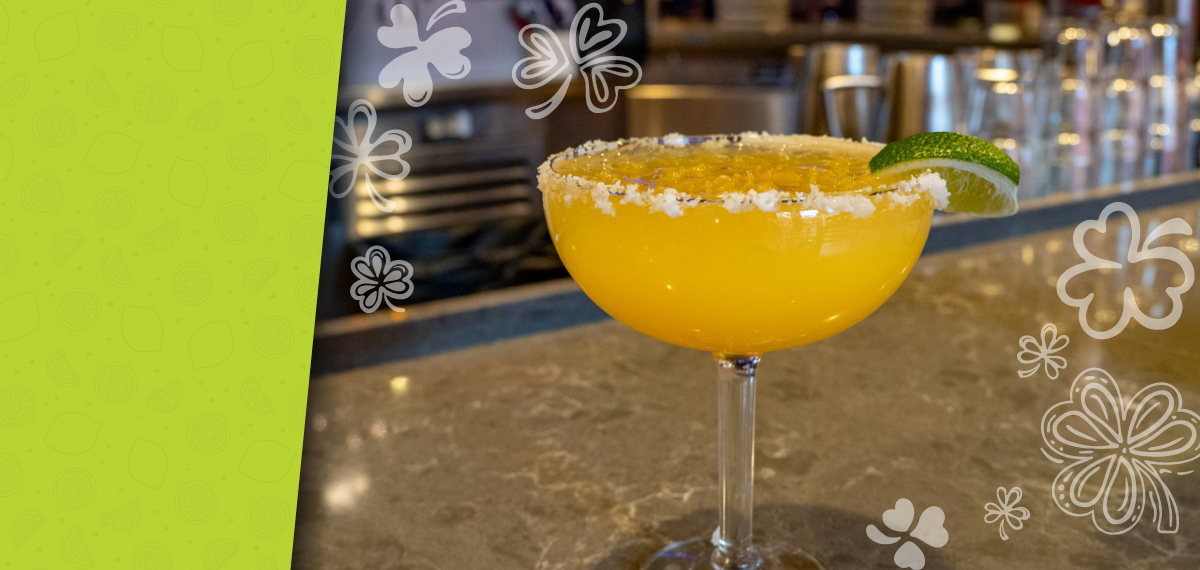 A golden-orange cocktail made with Mi Campo Reposado, house sour mix, Grand Marnier, Cointreau, and orange juice.