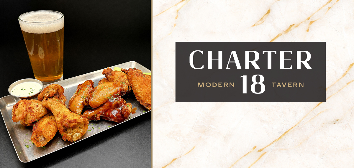 Chicken wings, dipping sauce, and a draft beer at Charter 18 Modern Tavern.