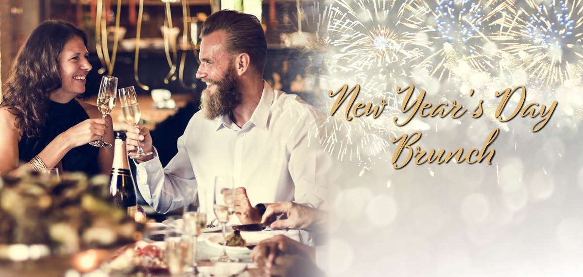 A couple toasting champagne for New Year's Day Brunch