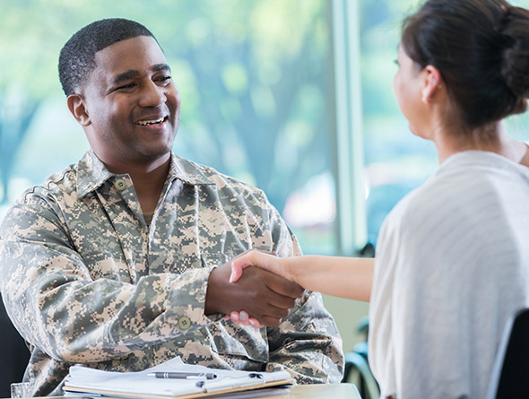 military member shaking hands