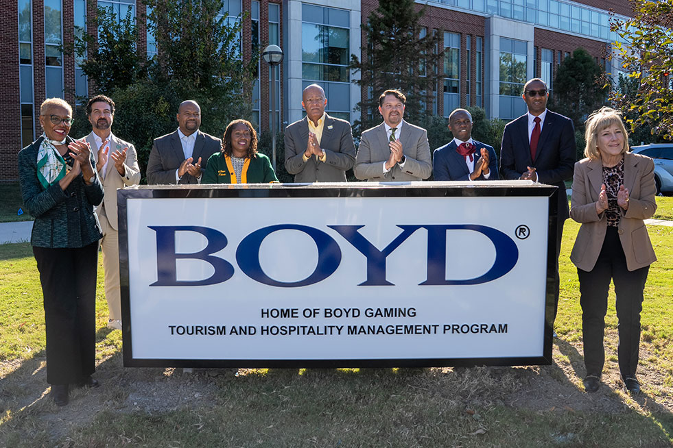 group picture at a Boyd sign