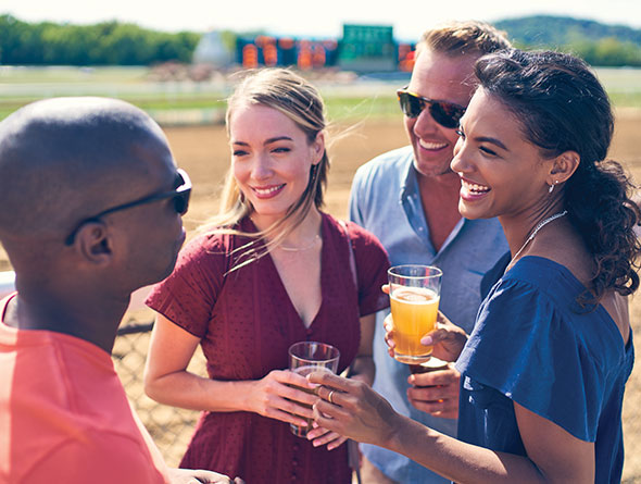 group of people at a horse race