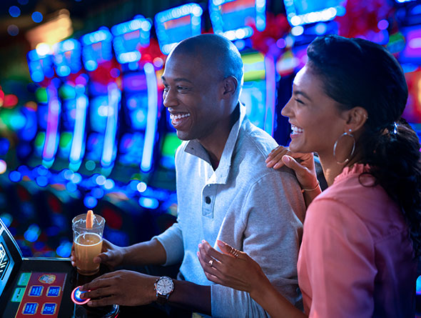 couple playing slots image