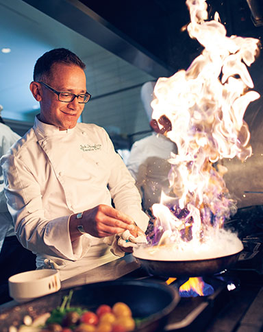 Chef with flaming dish image