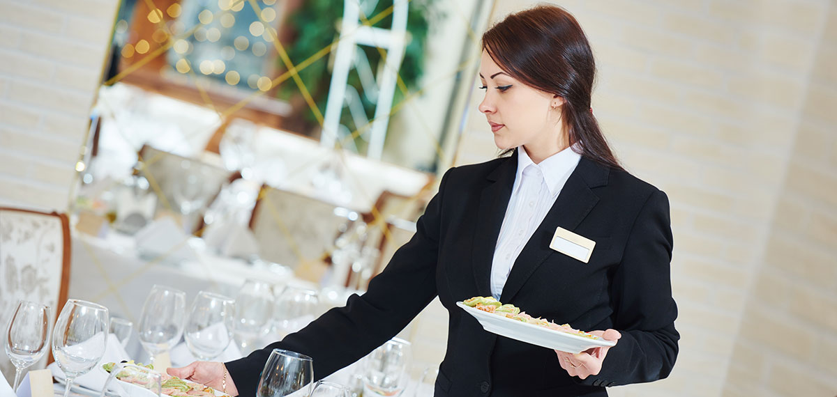 woman setting up banquet image