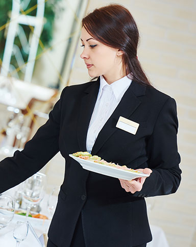 woman setting up banquet image