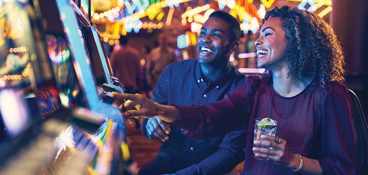 Couple playing slots image