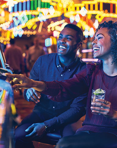 Couple playing slots image