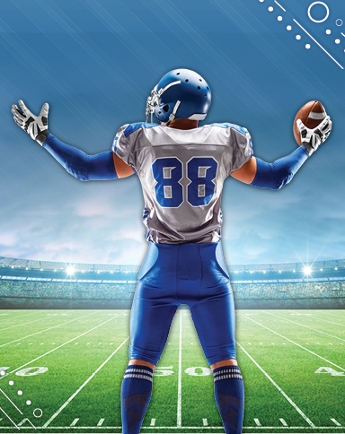 Man in Football pads holding a football