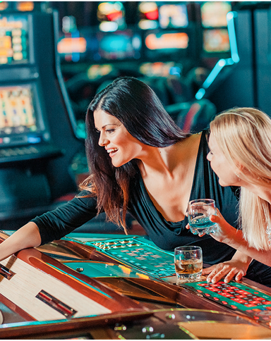 Women playing electronic table games