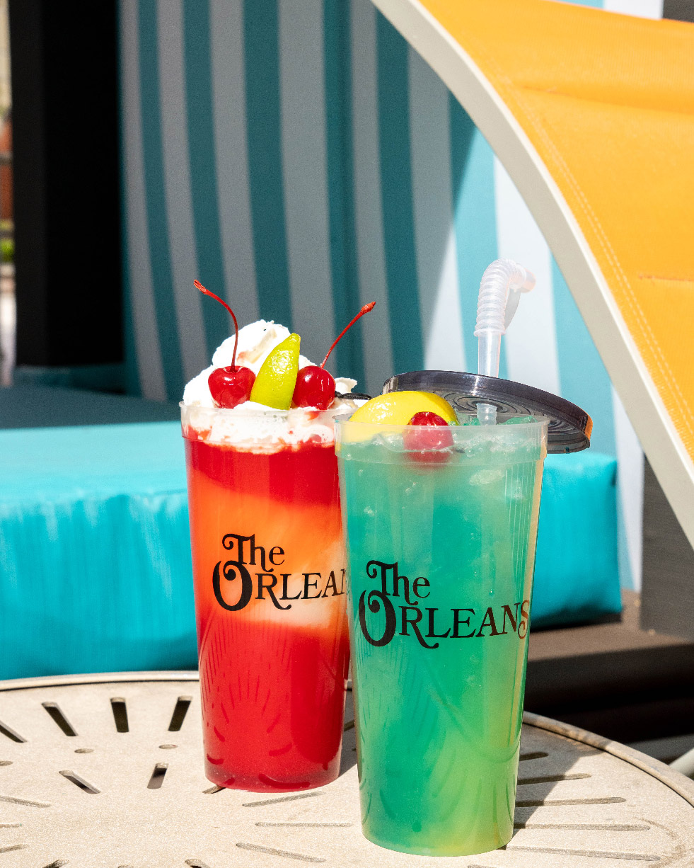 Cocktails in souvenir cups at the resort pool