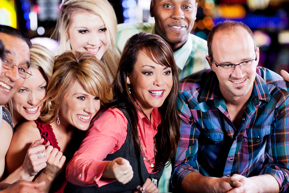 group of people playing craps in a casino